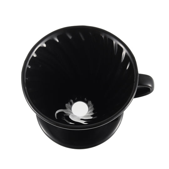 Top-angle view of the NERA Ceramic V-Shaped Pour Over Coffee Dripper, showcasing its spiral ridges and the large flow hole at the bottom, designed to optimize coffee extraction and flow control for a rich, flavorful brew. VEVOK CHEF ensures precision brewing with every cup.